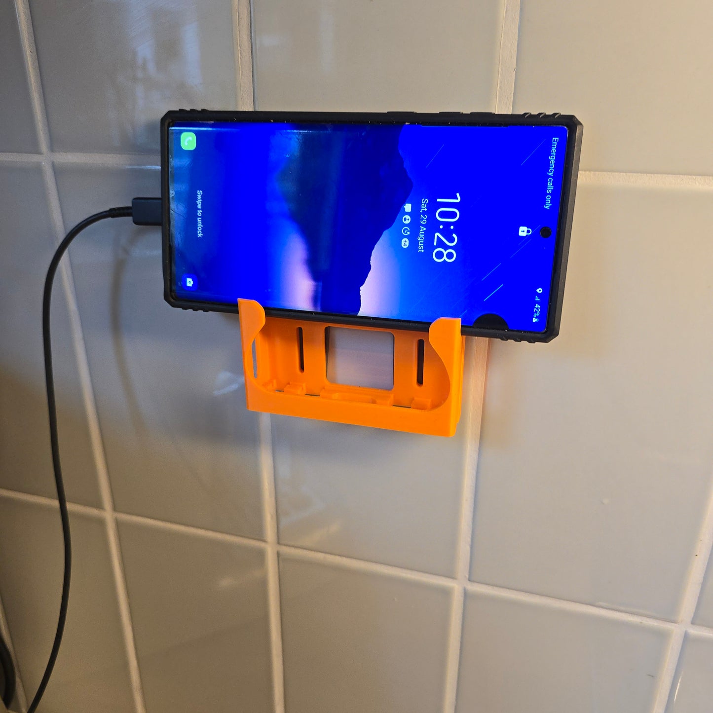 FlexDock-V2™ Self-Adhesive Wall Phone Holder – Universal Mobile Dock  with charging port access | Made in UK by Creowaves